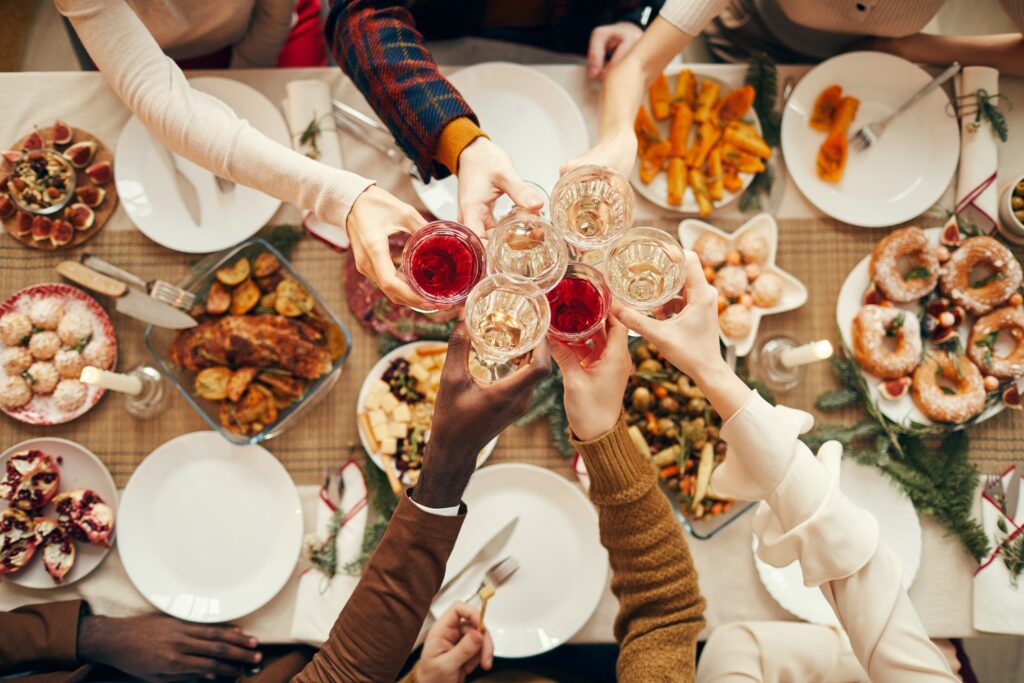 Family doing cheers at holiday meal